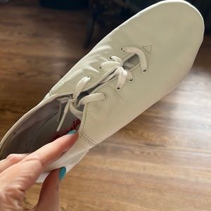 We are selling these white ballet shoes.